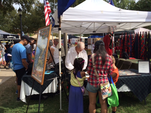 Members talk to attendees at the 2015 Plano International Fest.